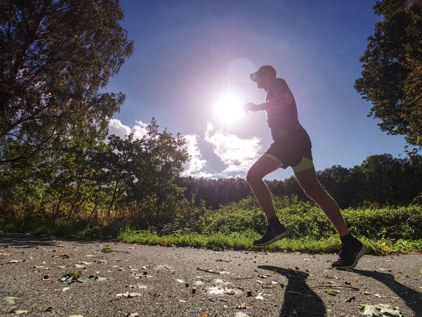 Man is training, prepare his body for marathon run. Marathon popular sport challenge to improve yourself.  - Fotó, kép
