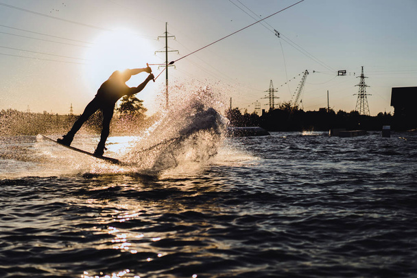 wakeboard. wakeboarding jumping at sunset - Foto, immagini