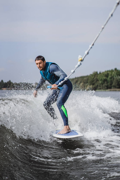man on wakesurfing. wave from the boat. - Photo, image
