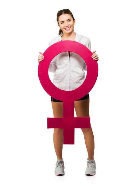 Молода жінка тримає жіночий знак
 - Фото, зображення