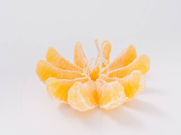 citrus fruit mandarin orange on white background with zest - 写真・画像