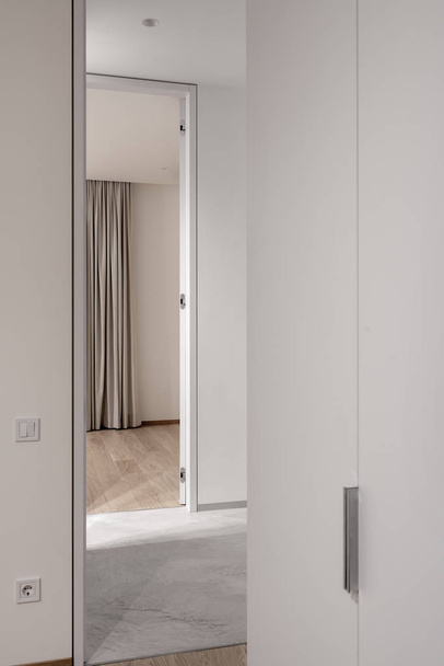 Stylish modern interior with light walls and different floor covering - Valokuva, kuva