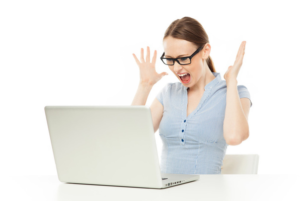 Shocked businesswoman looking at laptop - Photo, image