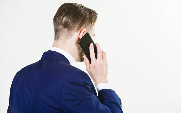 Mobile negotiations. Call technical support service. Businessman hold smartphone near. Man formal suit call support service. Mobile call conversation. Consultation and help. Business call concept - Photo, Image