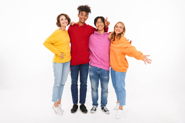 Group of cheerful teenagers isolated over white background - Foto, afbeelding
