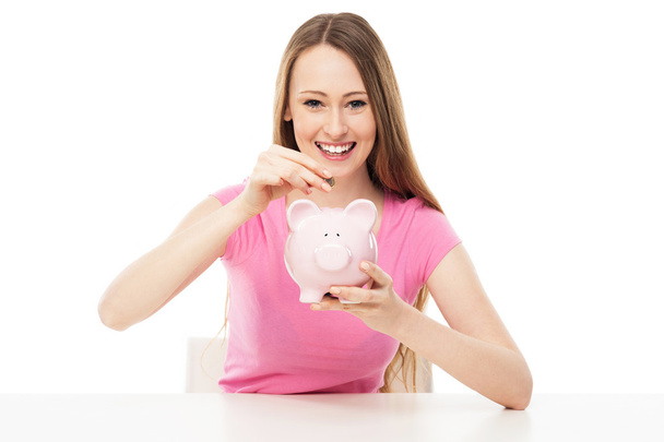 Young woman with piggy bank - Foto, Bild