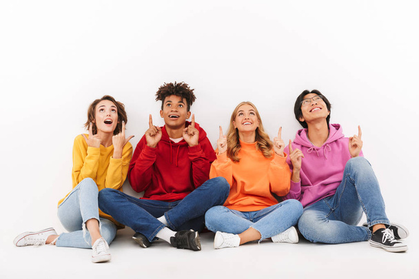 Group of cheerful teenagers isolated over white background - Φωτογραφία, εικόνα
