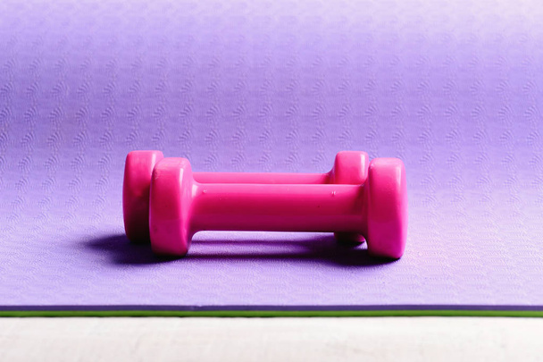Barbells in small size, close up. Shaping and fitness equipment. - 写真・画像