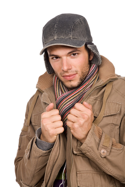 Studio picture of a young man dressed for winter - Foto, imagen