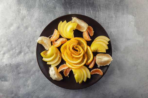 Fruit salad of fresh sweet apple, tangerine. Healthy vegetarian food. top view - Fotografie, Obrázek