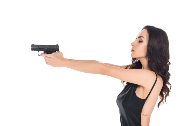 beautiful female killer aiming with gun isolated on white - Φωτογραφία, εικόνα