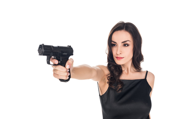 attractive female killer aiming with gun isolated on white - Photo, image