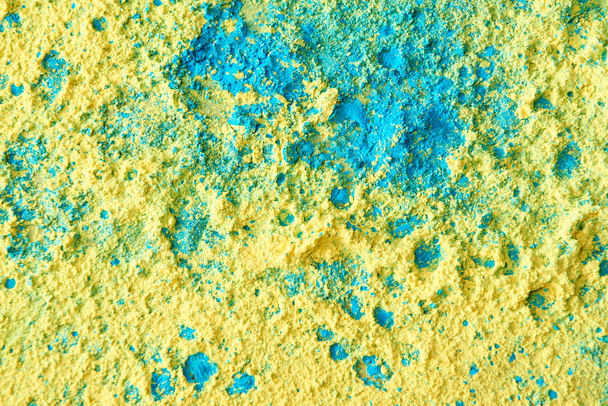 close up of yellow, green and blue holi powder - 写真・画像