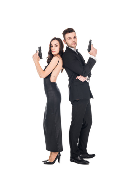 pareja de agentes secretos posando con arma, aislados en blanco
 - Foto, Imagen