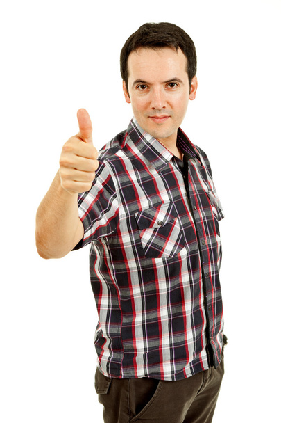 Jovem homem casual retrato indo polegar para cima em um fundo branco
 - Foto, Imagem