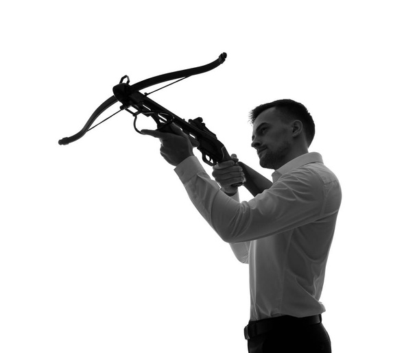Portrait of young businessman with crossbow on white background - Φωτογραφία, εικόνα