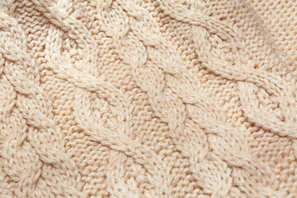 Light knitted clothes, closeup - Fotó, kép