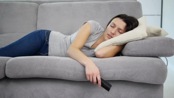 The woman sleeps sweetly on the couch - Felvétel, videó