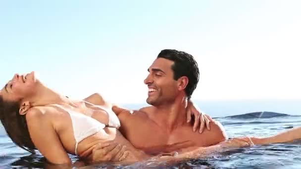 Happy couple in a swimming pool - Footage, Video