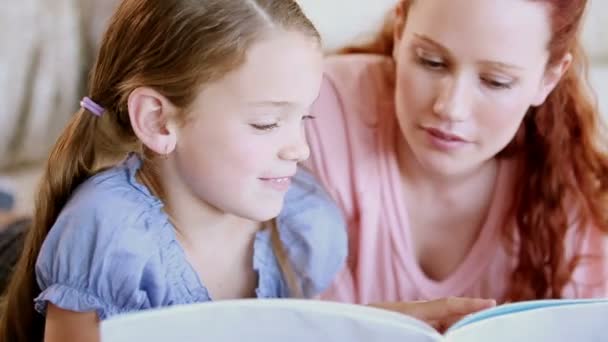 Young girl reading a book aloud - Video