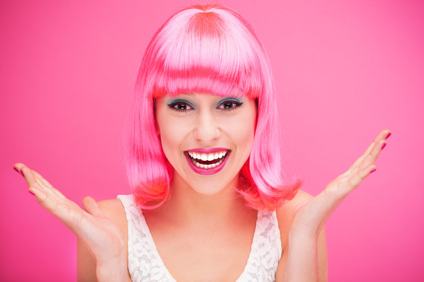 Beautiful young woman with pink hair - 写真・画像