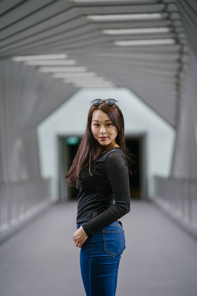 Portrait of a young Chinese Asian woman posing - Фото, изображение