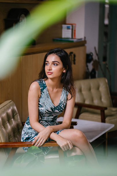 Portrait of a young, attractive and confident Indian Asian woman in a dress - Foto, afbeelding