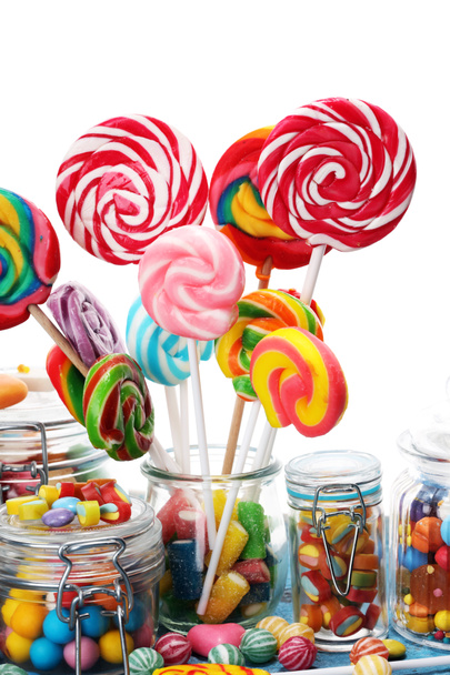 candies with jelly and sugar. colorful array of different childs sweets and treats in glass jar - Photo, Image