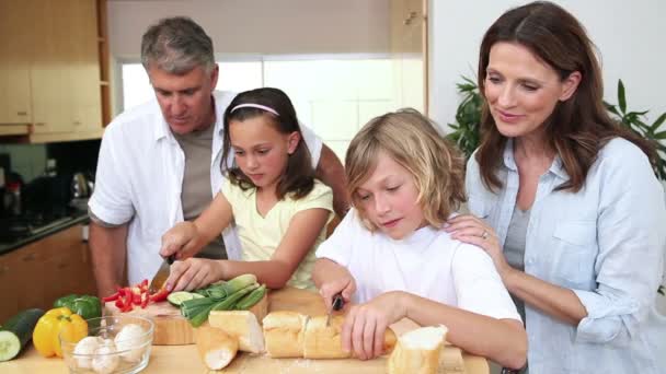 Family cooking together - Filmati, video