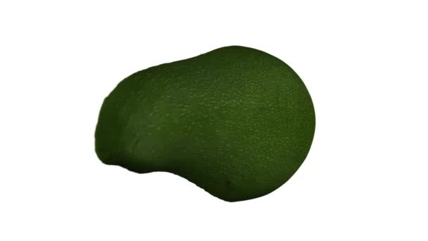 Realistische weergave van een draaiende groene Florida avocado (doormidden gesneden) op witte achtergrond. De video is naadloos looping, en het object is 3d gescand van een echte avocado. - Video