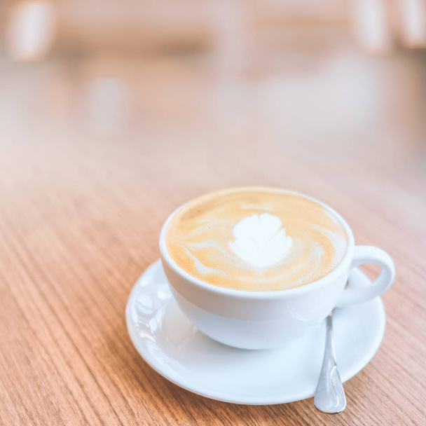 Hot coffee cup on wood table background. - Фото, зображення