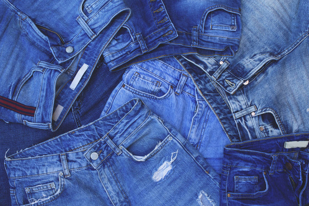 Stack blue jeans background. Denim texture. - Photo, Image