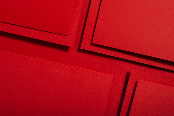 Red paper material design. Geometric unicolour shapes. Wallpaper design background. - Фото, изображение