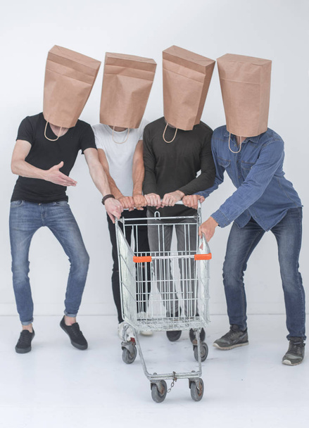 group of people with empty shopping carts. - Foto, afbeelding