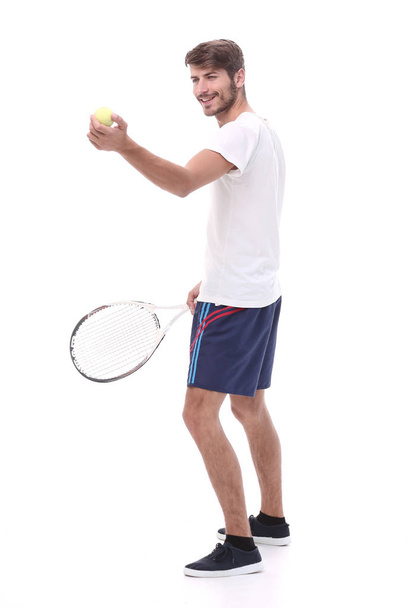 side view.smiling man with tennis racket. - Zdjęcie, obraz