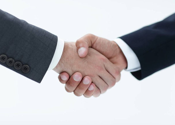 Крупный план деловых людей, пожимающих руки из-за сделки
 - Фото, изображение