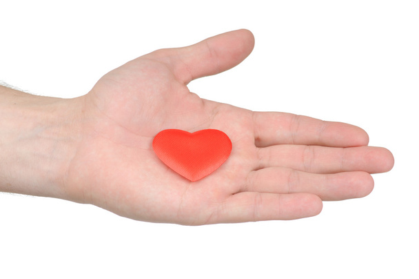 Coeur de Saint Valentin dans une main féminine isolée sur fond blanc
 - Photo, image