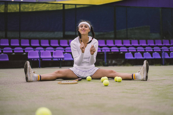 Portrait of beautiful woman playing tennis outdoor - Photo, Image