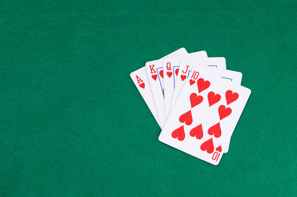 poker winning combination on green table - Foto, Bild
