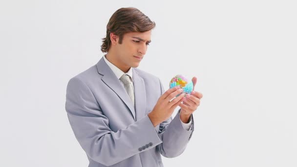 Businessman holding a small globe - Video