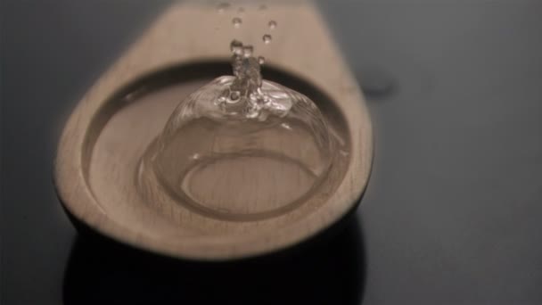 Bubble popping in super slow motion in a wooden spoon - 映像、動画
