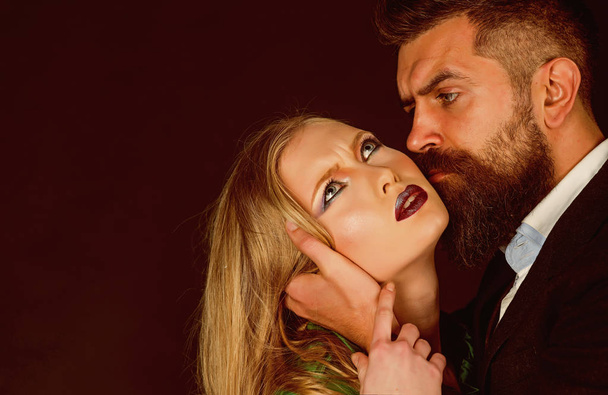 Joy of sexual desire. Fashion style and hair care. Couple in love. Bearded man hug woman with long hair. Intimate couple in fashion clothing. Style icons. They both love fashion, copy space - 写真・画像