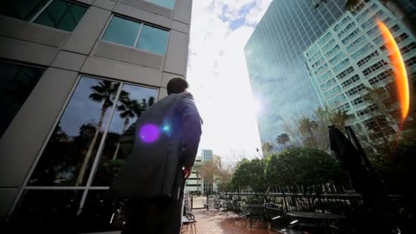 Satisfied Business Leader Outside Downtown Skyscrapers - Video