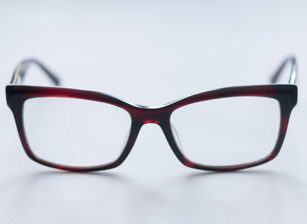 corrective glasses in dark frame on white background, stylish accessory - Foto, immagini
