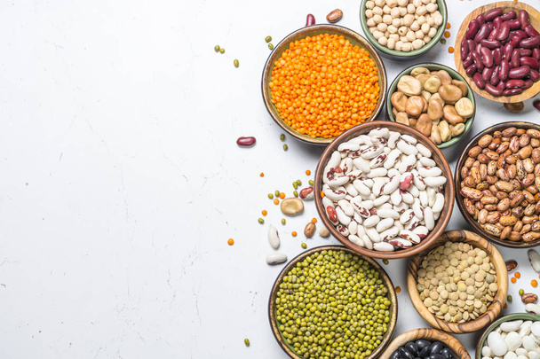 Legumes, lentils, chikpea and beans assortment on white. - Photo, Image