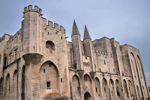 walls of the medieval Castle of the Popes in the city of Avignon in France - 写真・画像