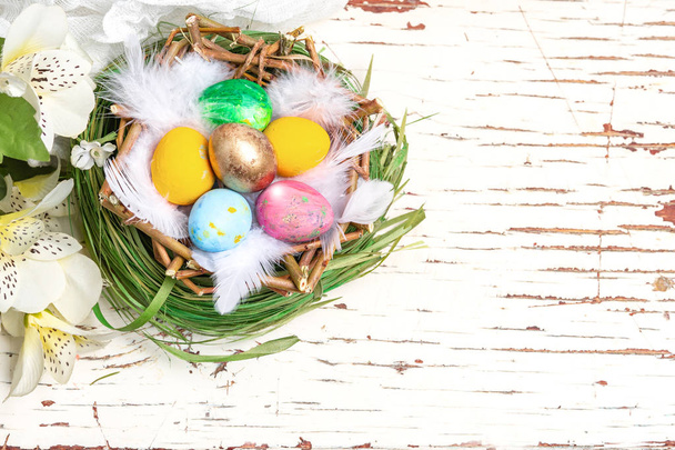 dyed colored eggs in a nest, Easter Christian traditional holiday, catholic - Fotó, kép