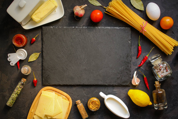 pasta, ingredients, tomato (slate on the table) - Photo, Image