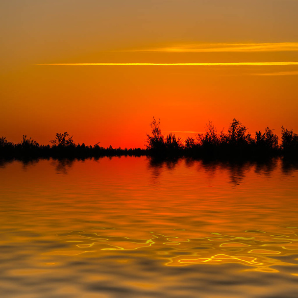 dranatic red dusk sky reflected in the lake - Zdjęcie, obraz