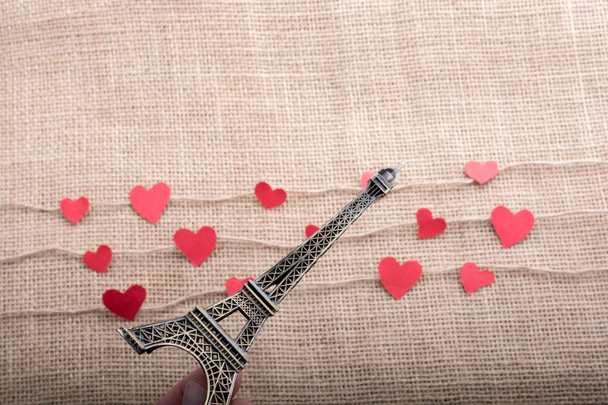 Love concept with Eiffel tower and paper heart on threads - Photo, Image